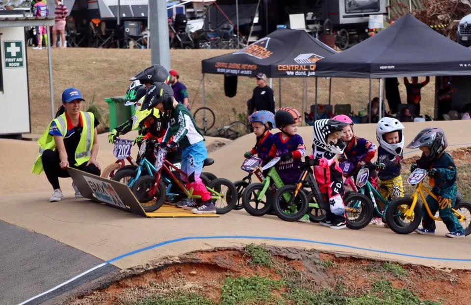 Young children from Moranbah BMX Club participate in a coaching session at the track