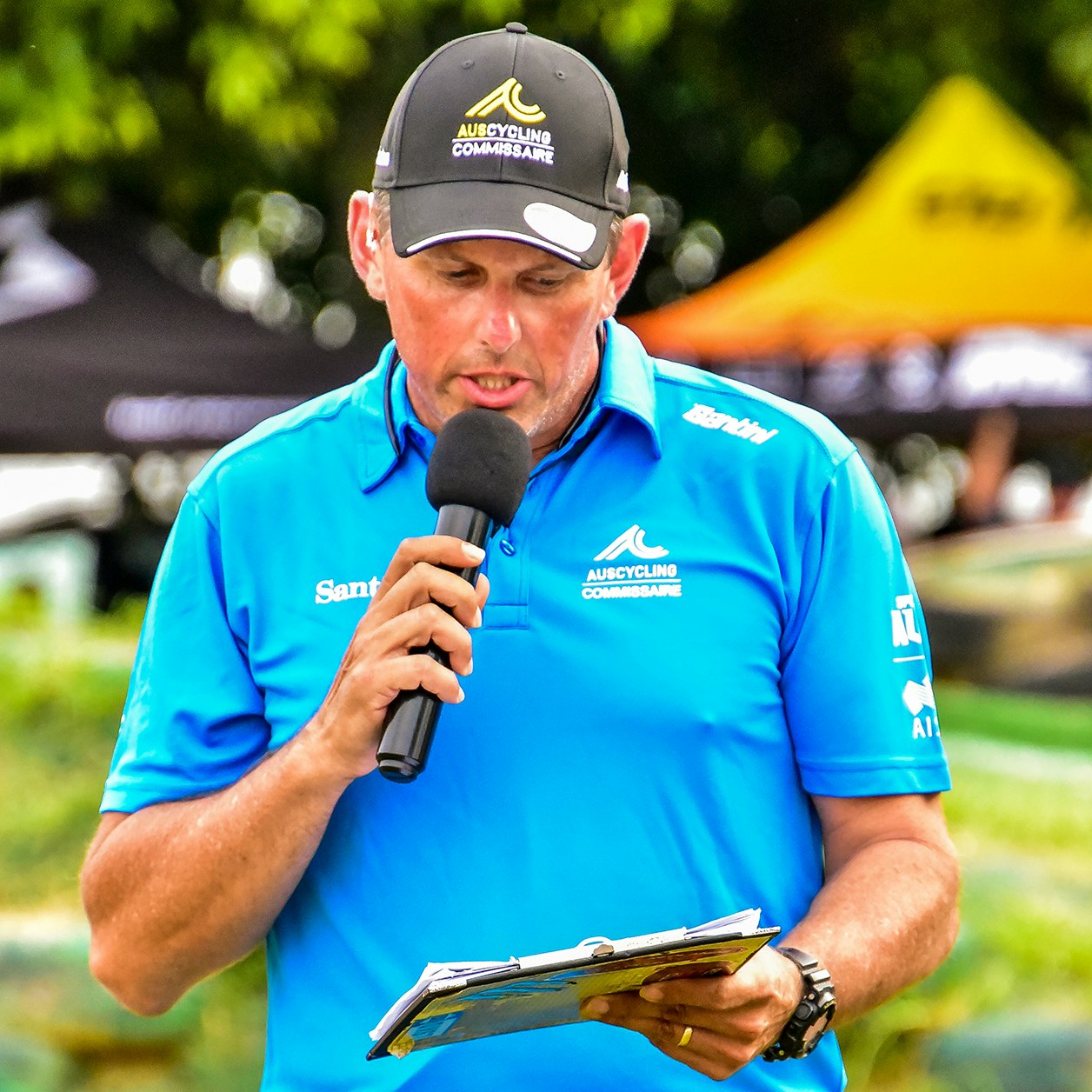 Commissaire making announcement at race event
