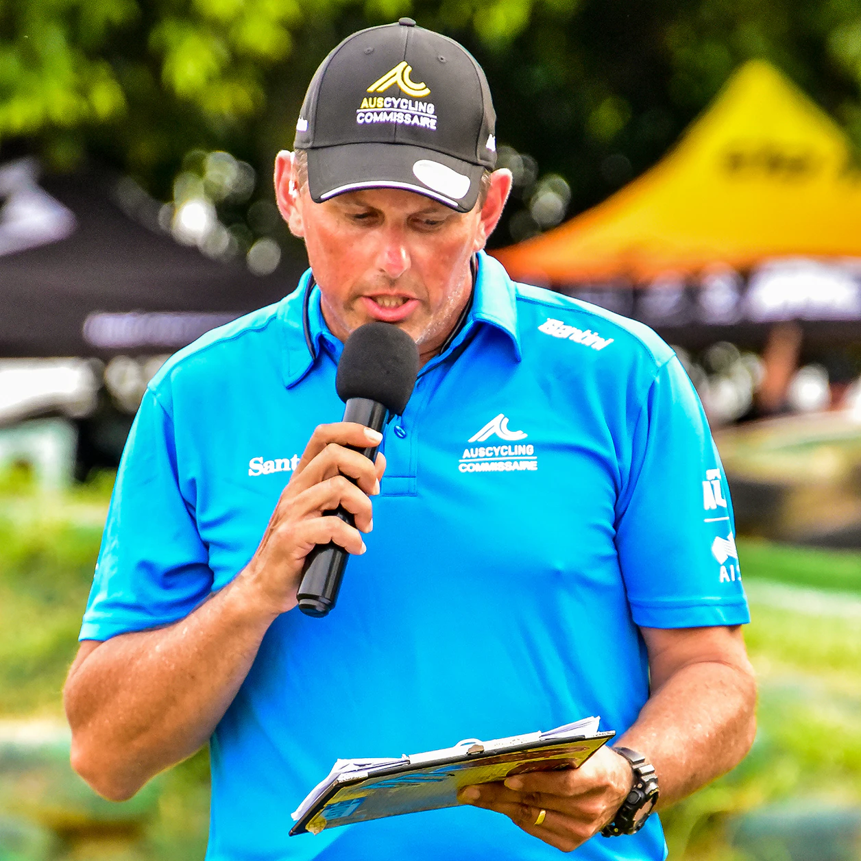 Commissaire making announcement at race event