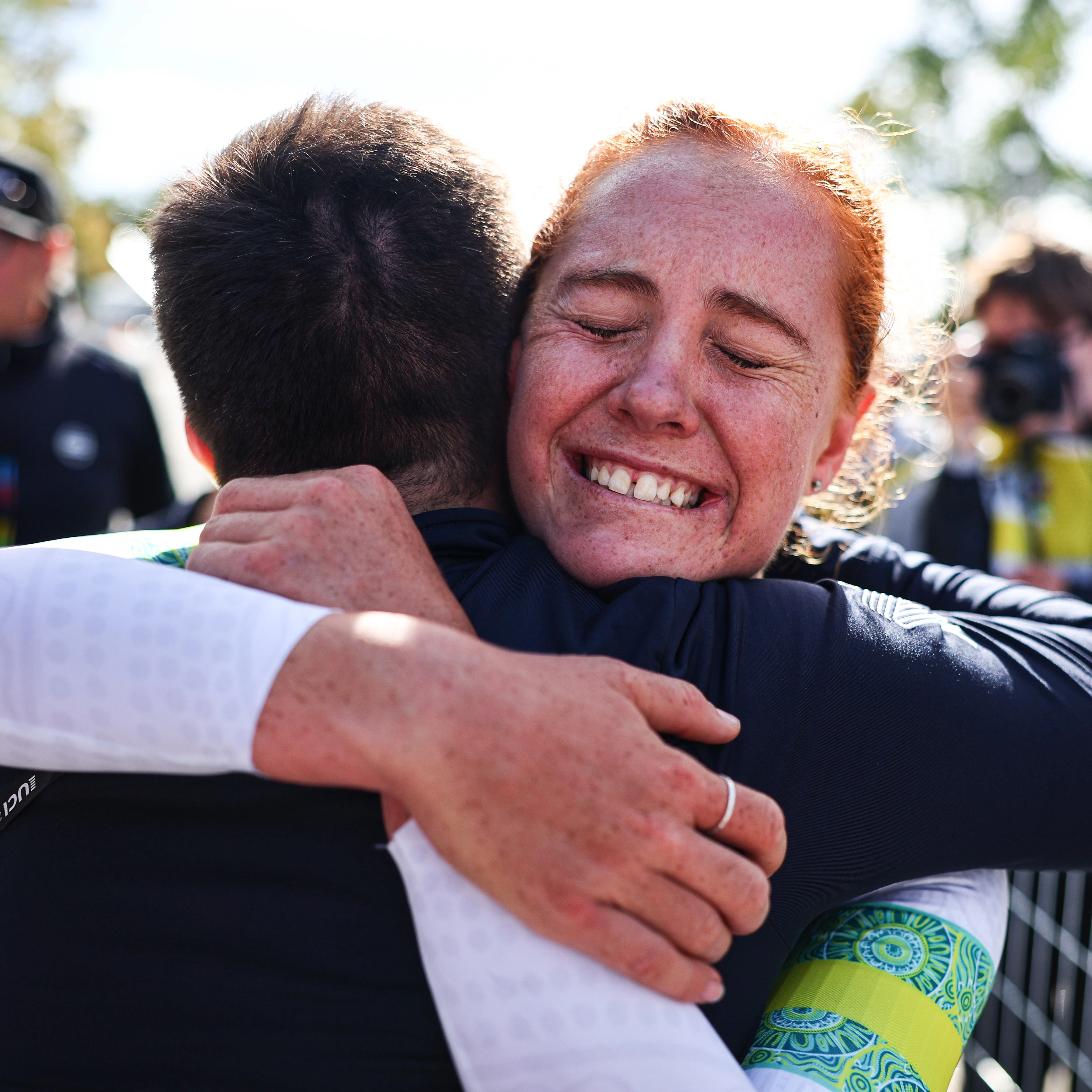 Felicity Wilson-Haffenden hugging a staff member of the ARA Australian Cycling Team after winning the Under-23 Women Individual Time Trial at the 2026 UCI Road World Championships in Montreal.