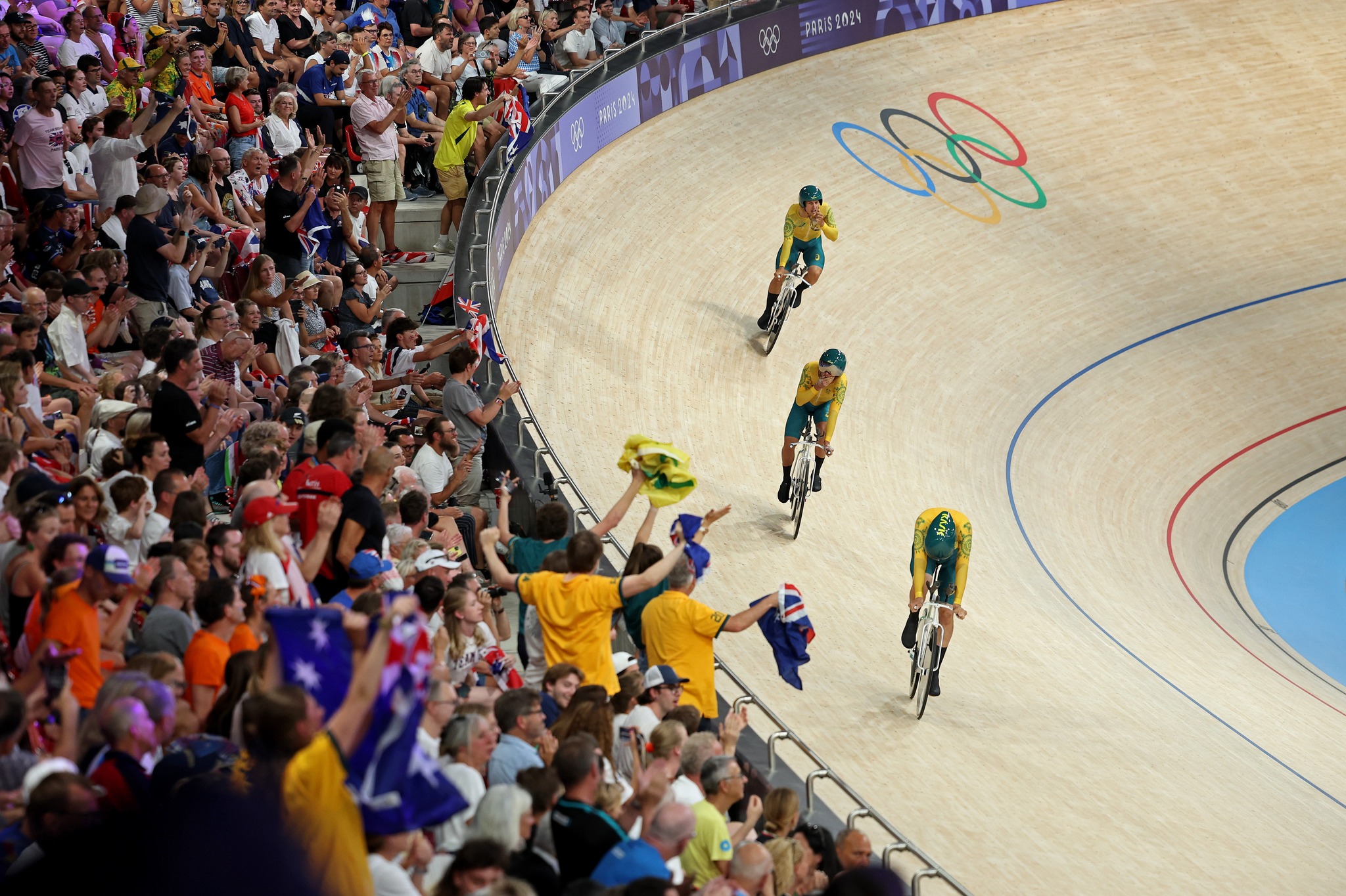 Conor Leahy, Oliver Bleddyn and Sam Welsford celebrate after winning team pursuit gold at Paris 2024. Picture: Getty Images.