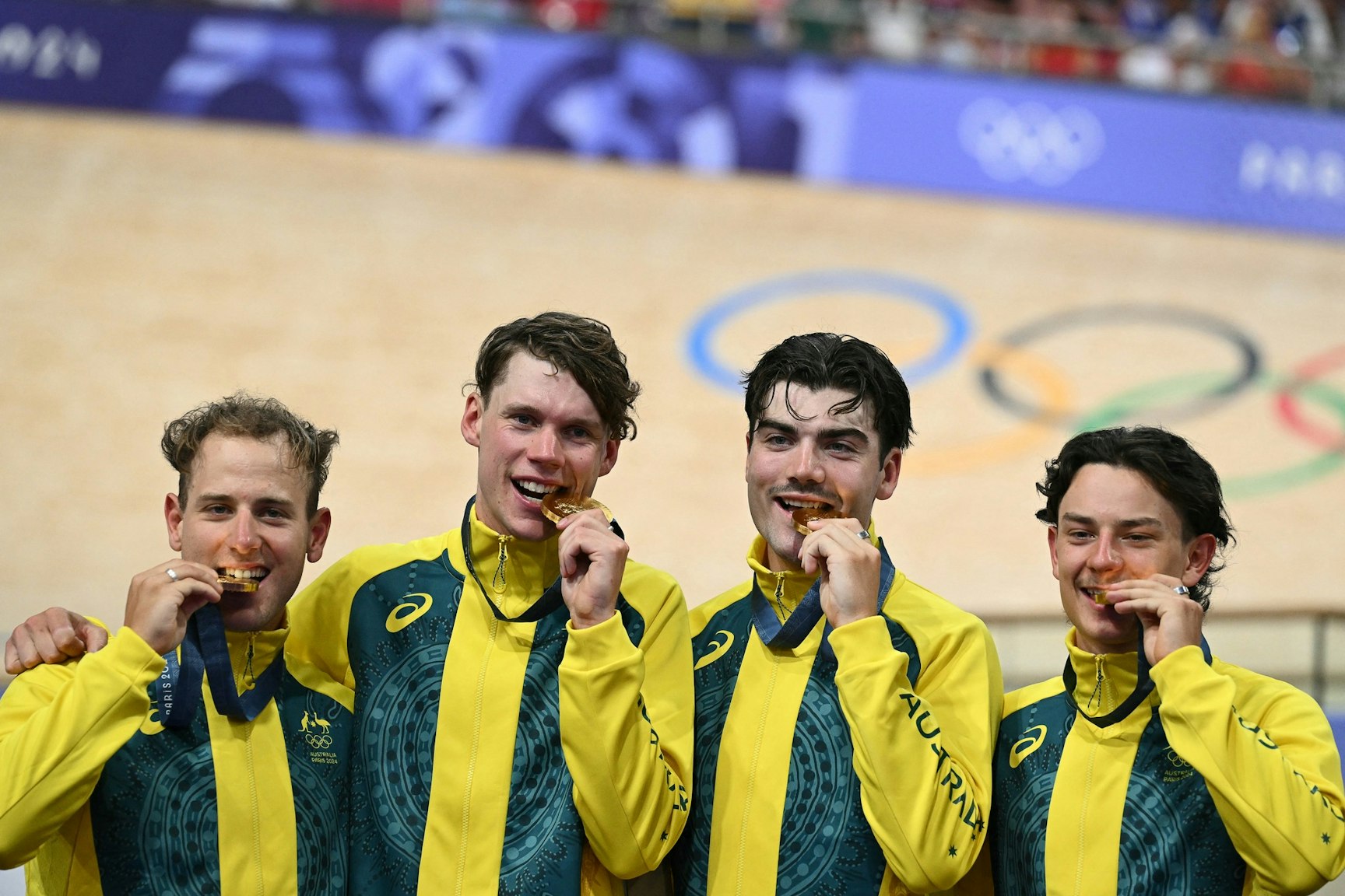 Sam Welsford, Kelland O'Brien, Conor Leahy and Oliver Bleddyn with their gold medal at the Paris 2024 Olympic Games. Picture: Sebastien Bozon/Getty Images.