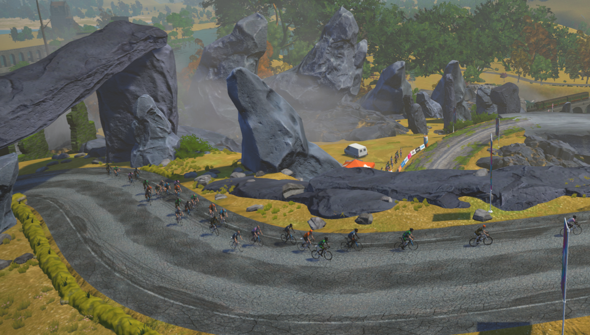 A screenshot from Zwift showing an aerial view of cyclists climbing the Sgurr on the Scotland map